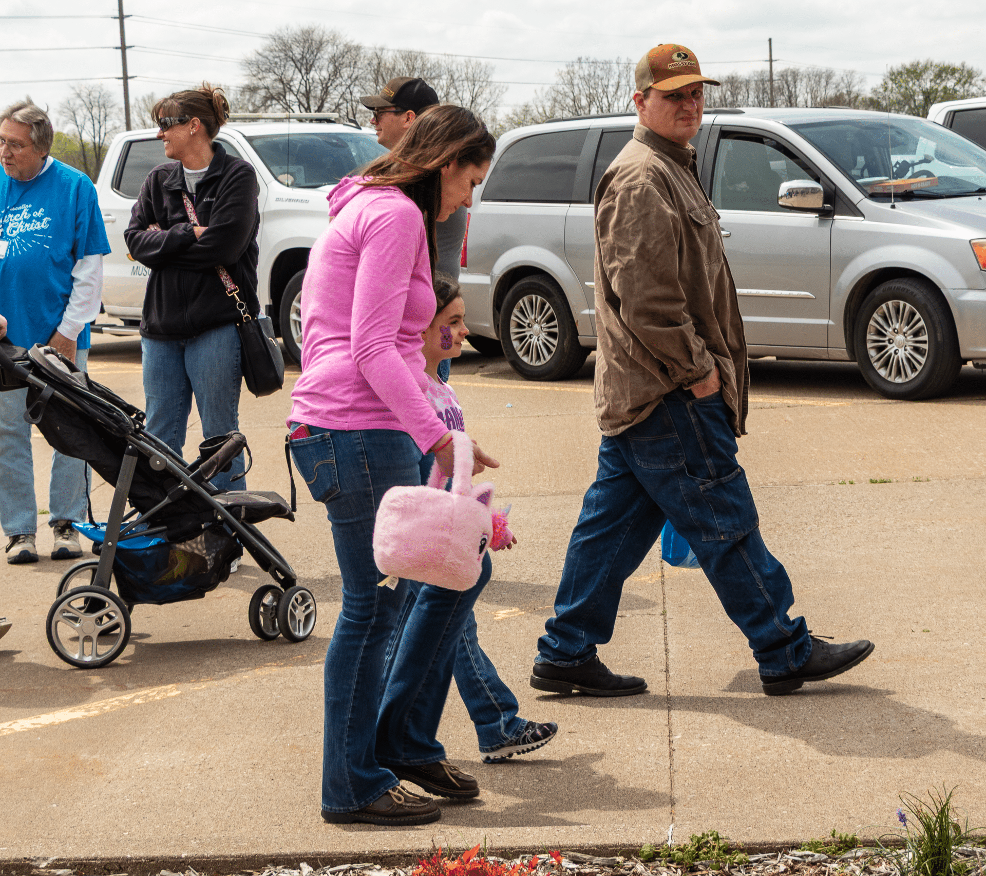 A welcoming family walks together to church, carrying hope and joy—everyone is invited to join our caring community. - Muscatine Church of Christ