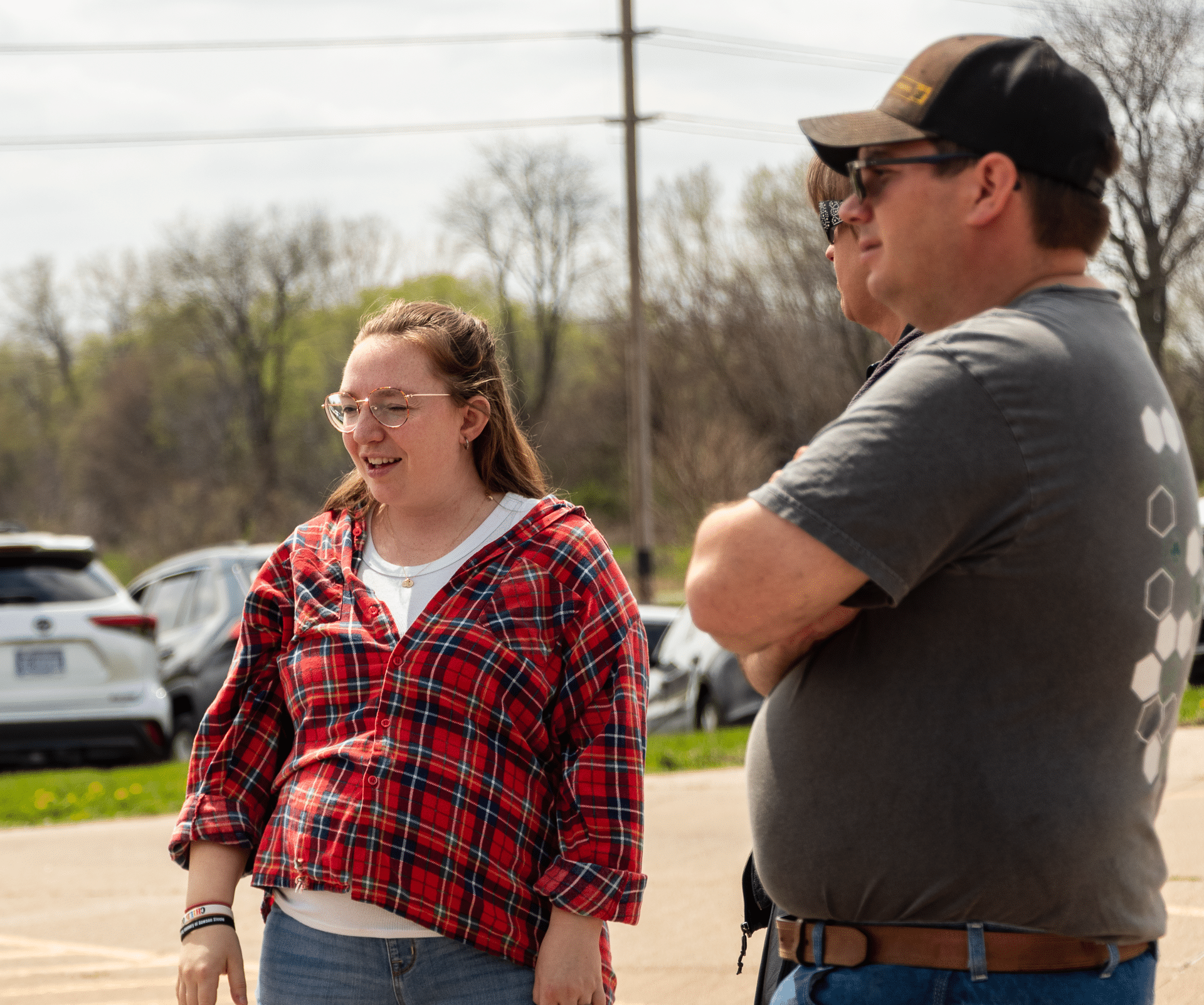 Three friends share a warm conversation outdoors—welcoming smiles and hope fill our Muscatine Church family. - Muscatine Church of Christ