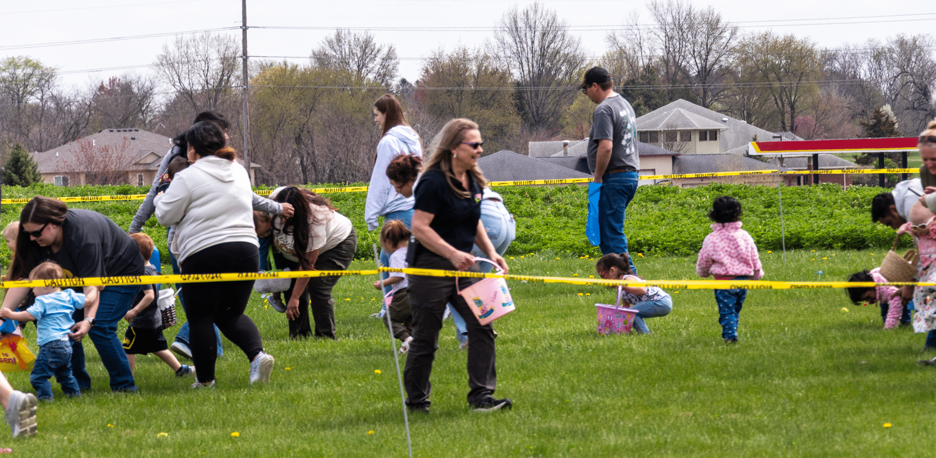 Families and children enjoy an outdoor egg hunt together, sharing laughter and hope in our welcoming community. - Muscatine Church of Christ