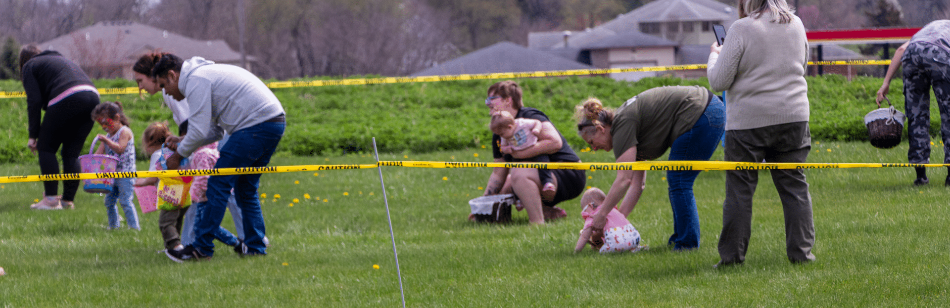 Church family of all ages enjoying outdoor games together—lending hands, sharing joy, and building hope. - Muscatine Church of Christ