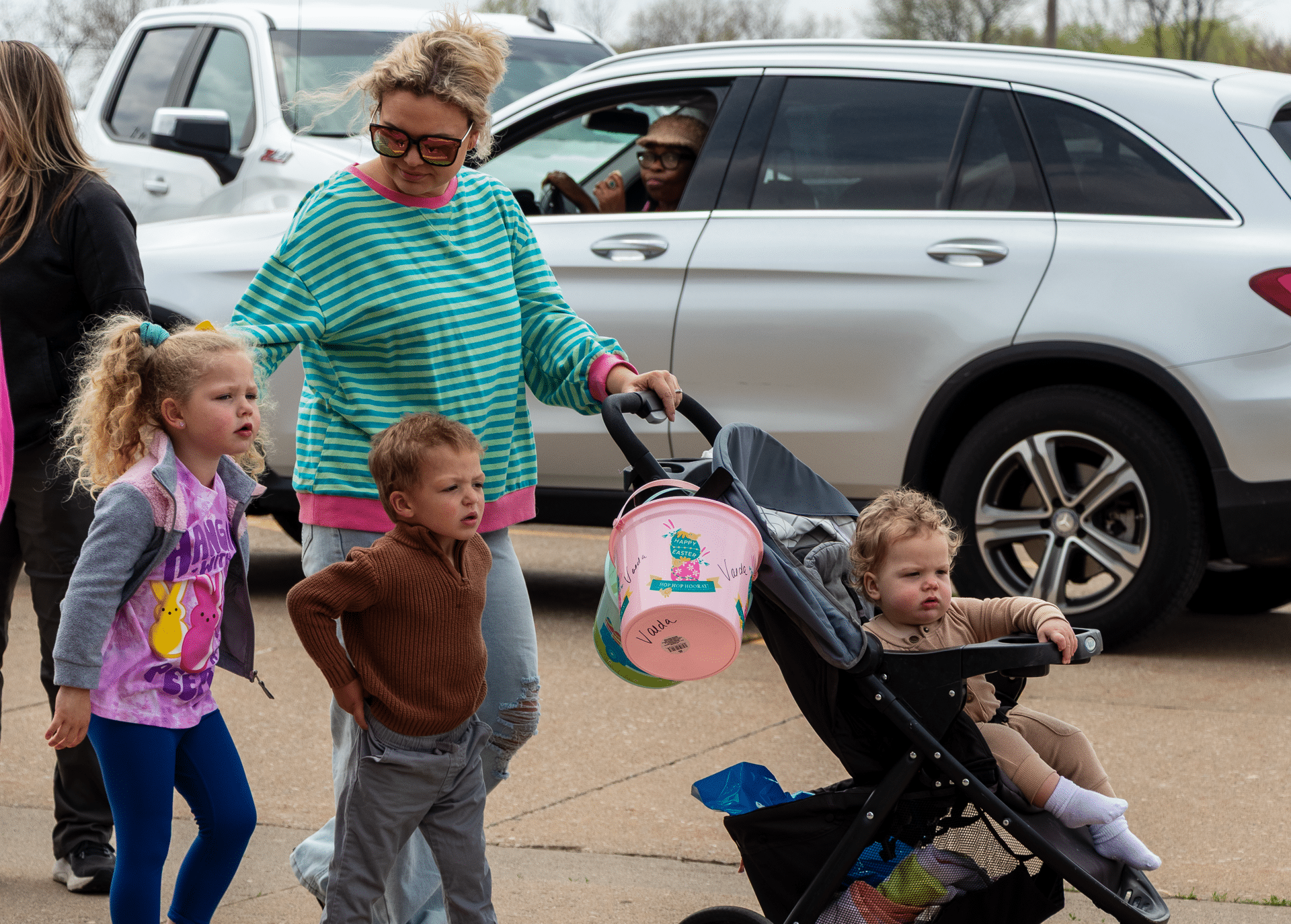 A caring mom with her kids enjoys a walk together, sharing smiles and hope in our welcoming church community. - Muscatine Church of Christ