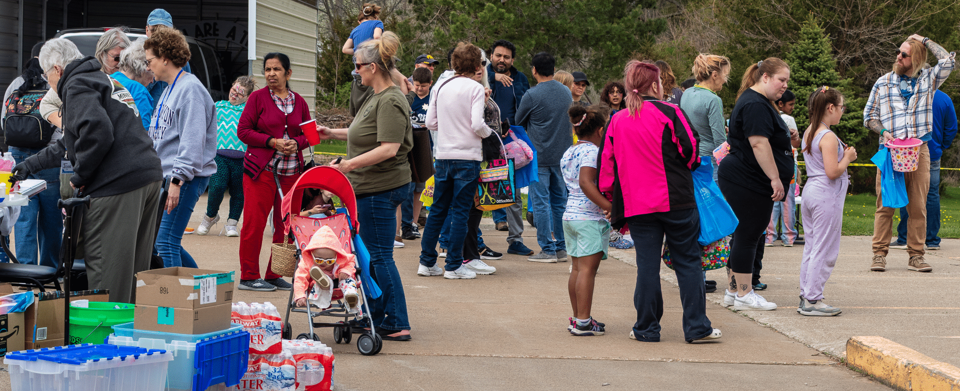 Neighbors and families gather outdoors, sharing smiles, support, and hope at our community event. - Muscatine Church of Christ