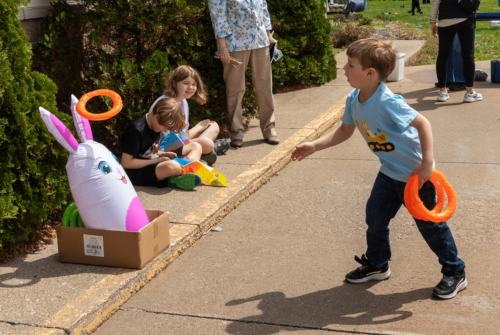 Children enjoy a sunny day together, playing games and making memories at our welcoming church community event. - Muscatine Church of Christ
